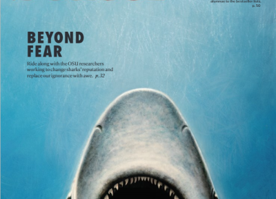 Front page magazine cover featuring a shark swimming up towards the surface where the magazine title text is featured saying "Oregon Stater". Under the water, the text "Beyond Fear."